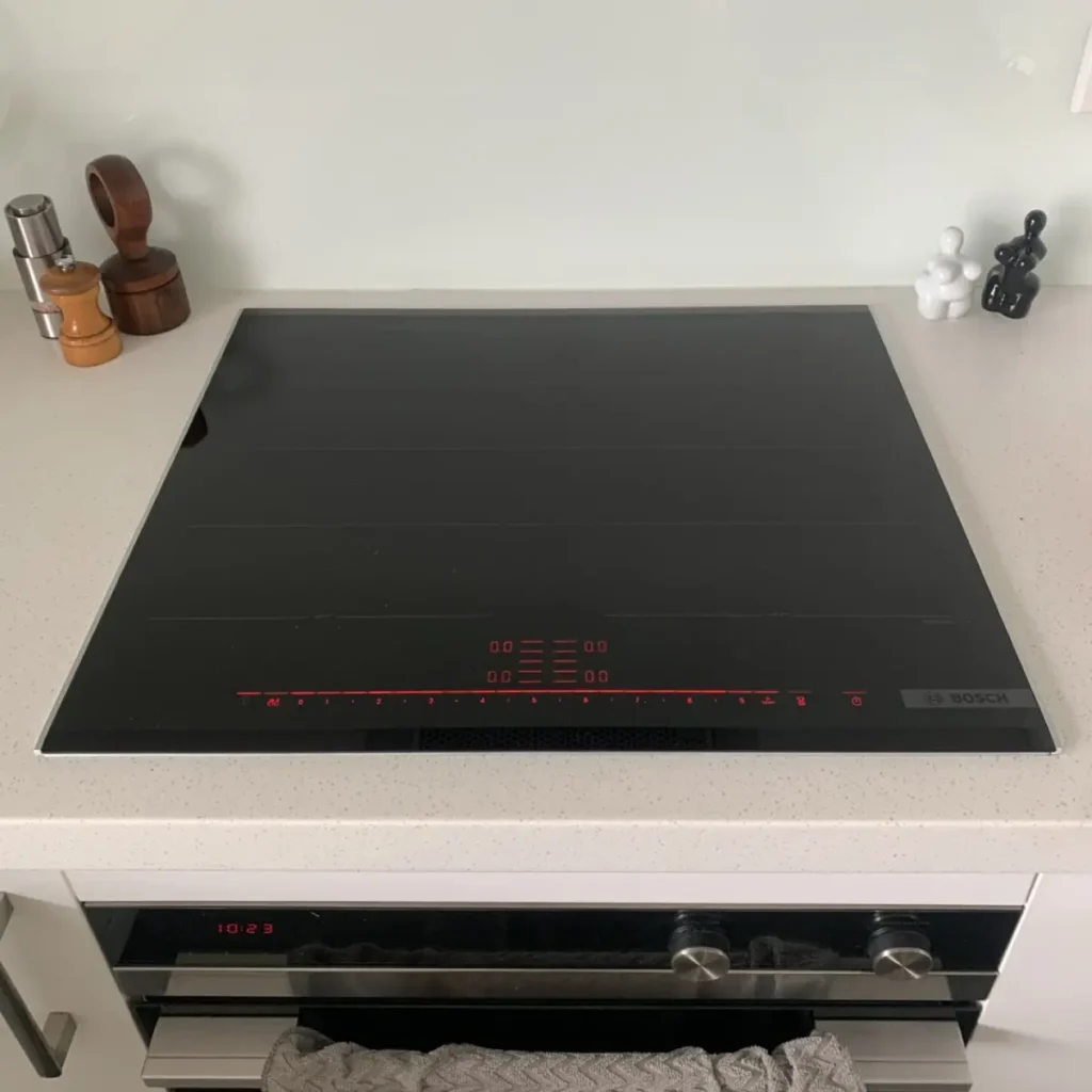 Bosch induction hob installed in Christchurch kitchen replacing old cooktop.
