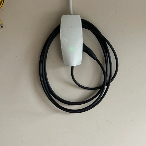 Tesla EV charger installed on a wall in Christchurch home