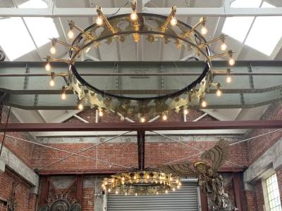 Restored bronze church feature lights with 20-bulb fittings, professionally installed by Easy Electrical in Christchurch – striking heritage lighting with modern safety upgrades