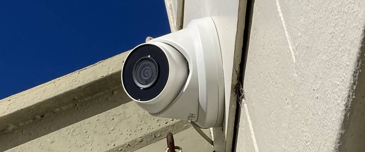 Security camera professionally installed on exterior wall by Christchurch electrician.