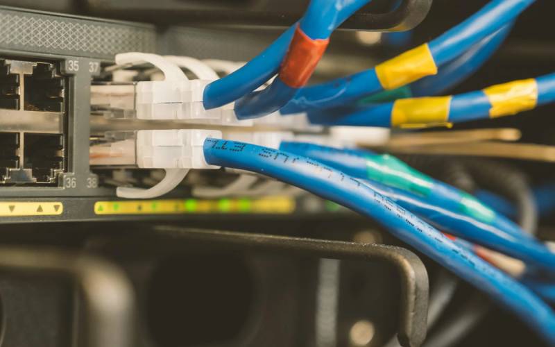 Patch cables connected to a network switch in a data cabinet