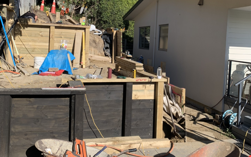 Outdoor electrical wiring and retaining wall installation during landscaping project – Christchurch electrician.