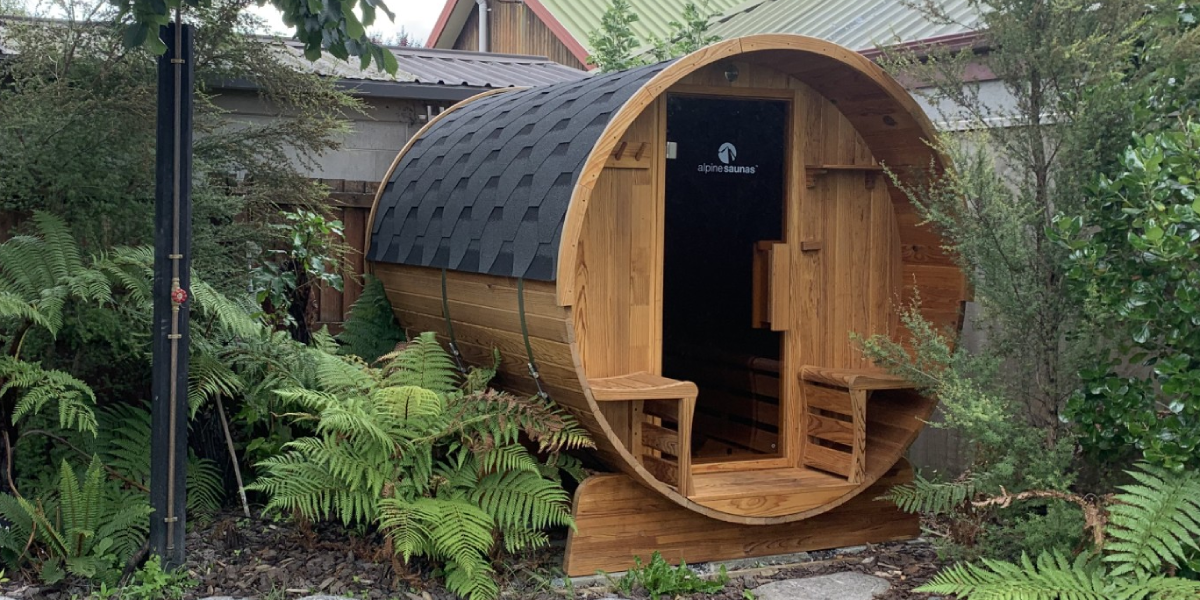 Outdoor barrel sauna safely wired and installed in secluded bush setting – professional electrical work by Easy Electrical Christchurch