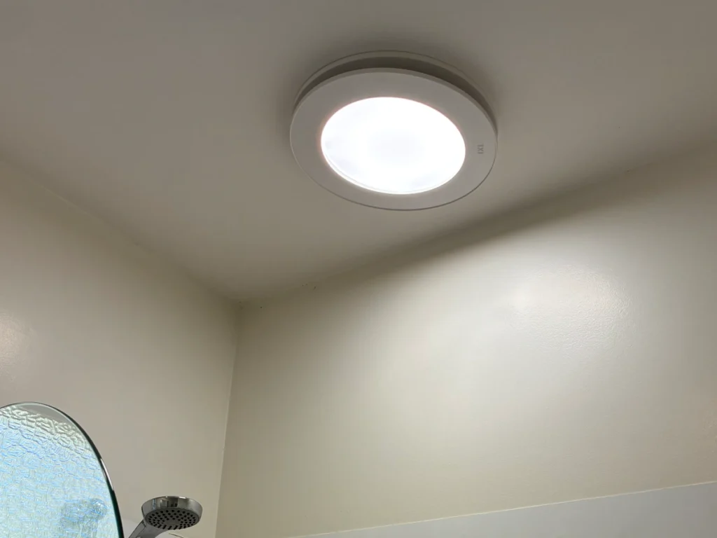 Bathroom light and extractor fan unit installed above a shower in Christchurch